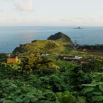 Sunset at Dragon head at Yongmeori Coast along the ocean, view from Sanbanggulsa temple, Sanbang-ro, Jeju Island, South Korea
