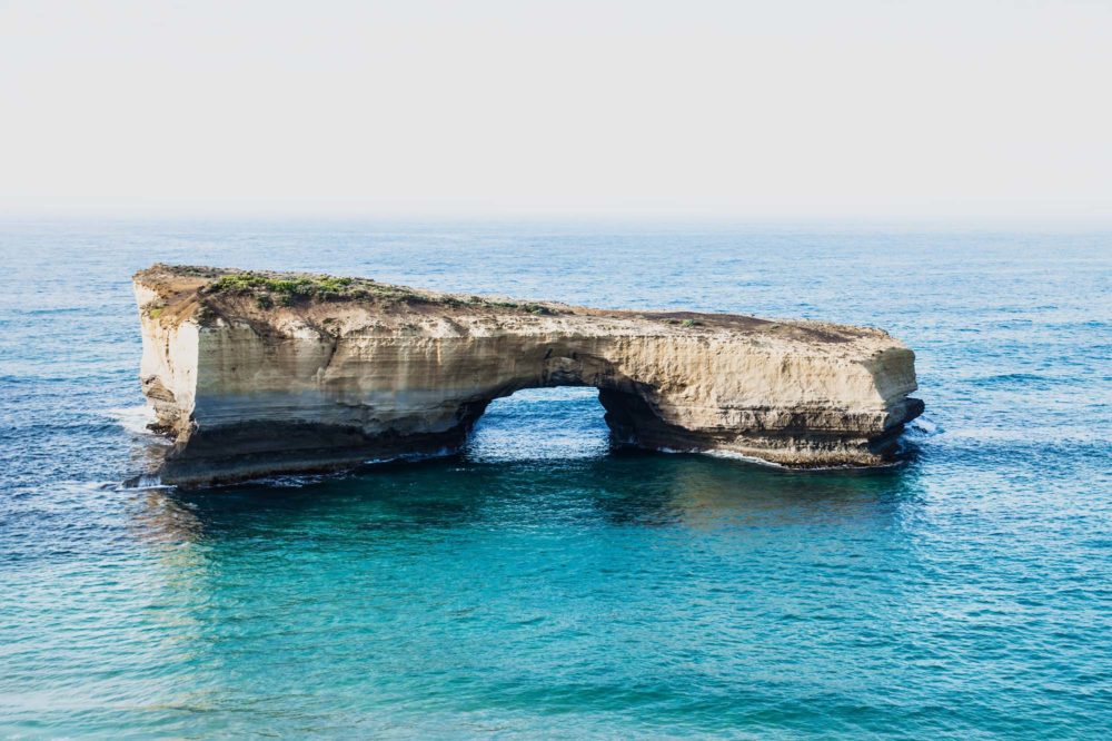 London Arch, limestone stacks in the turquoise ocean at Port Campbell National Park, by the Great Ocean Road in Victoria, Australia
