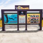 Korean warning sign for not stepping on the wavebreakers at, Jeju-si, Jeju Island, South Korea